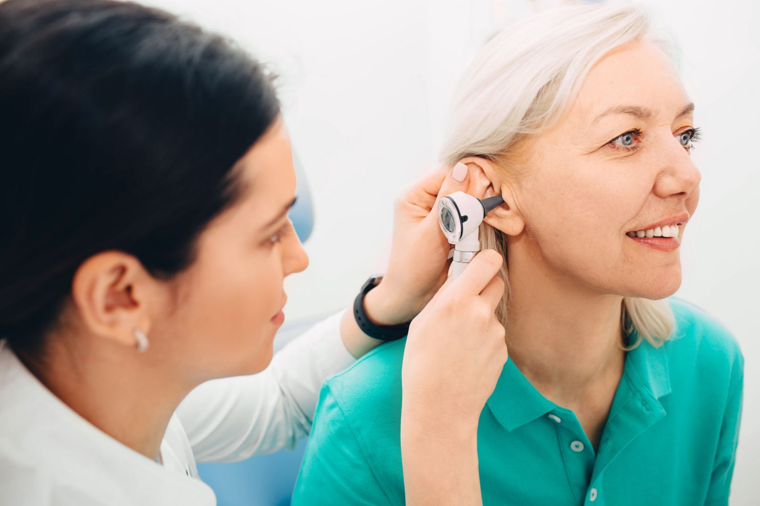 woman getting her ears checked at kichener hearing clinic