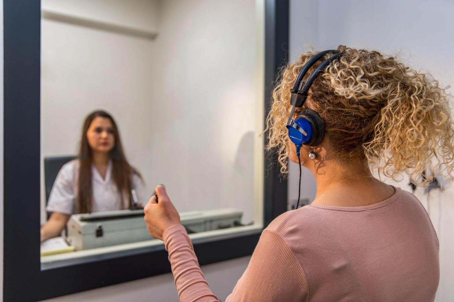 woman getting her hearing tested in Kitchener hearing clinic