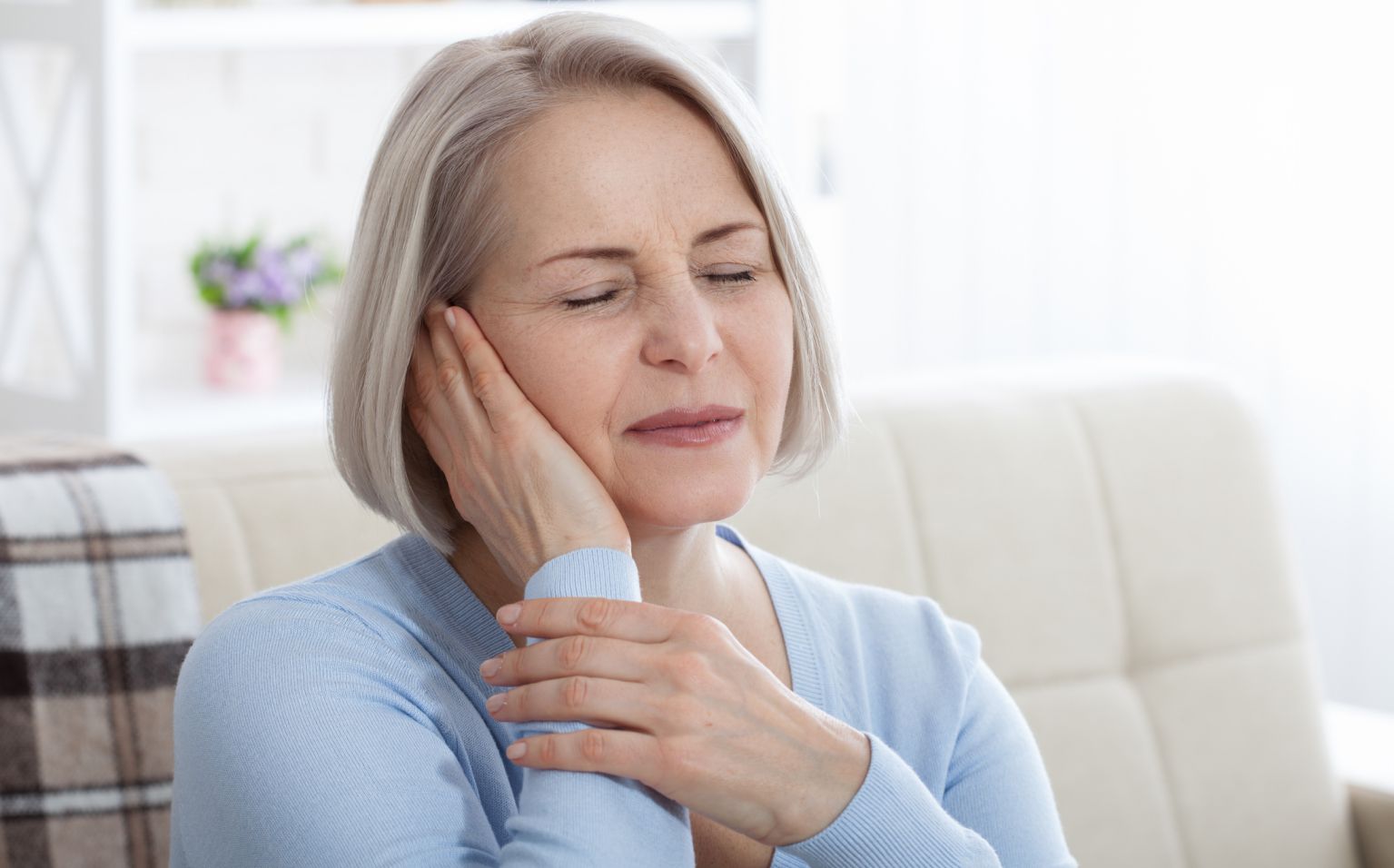 woman suffering from tinnitus