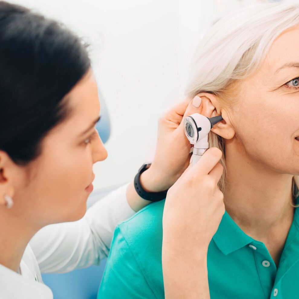 woman getting her ears checked at kichener hearing clinic