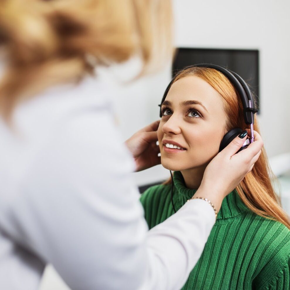 woman getting her hearing tested at Kitchener hearing clinic