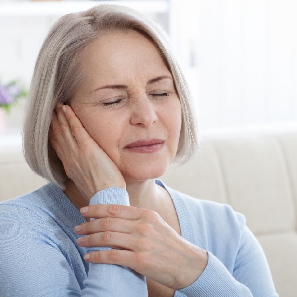 woman suffering from tinnitus